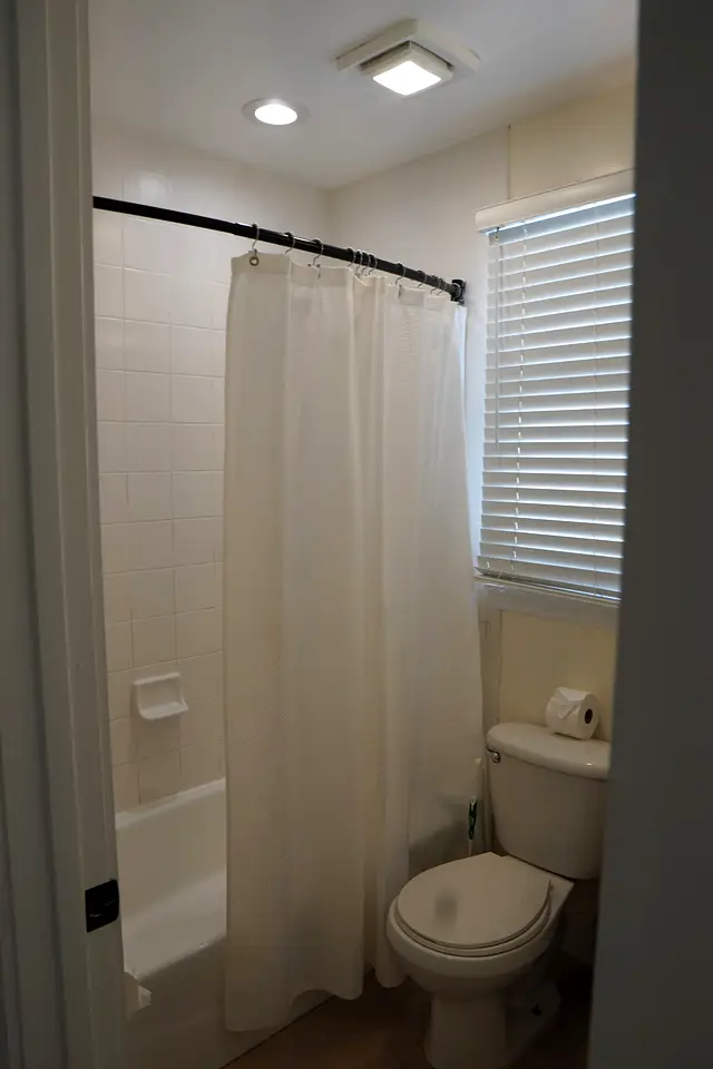 Bathroom at villa 5012 with a shower over the bath