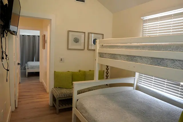 Bunk bedroom at villa 5012, looking through the doorway to the main bedroom