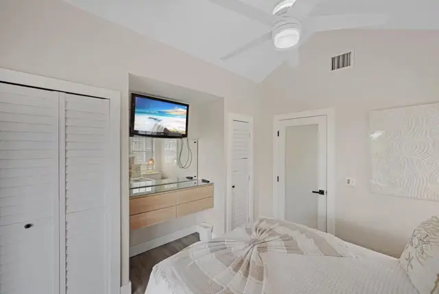 Bedroom at villa 5092 with a dresser and a television