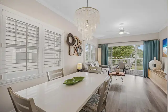Dining table at villa 5092 under a pendant light