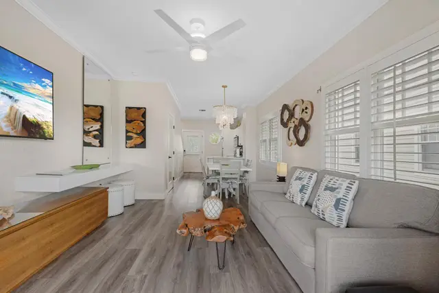 Open living and dining area at villa 5092, with a dining table and a sofa